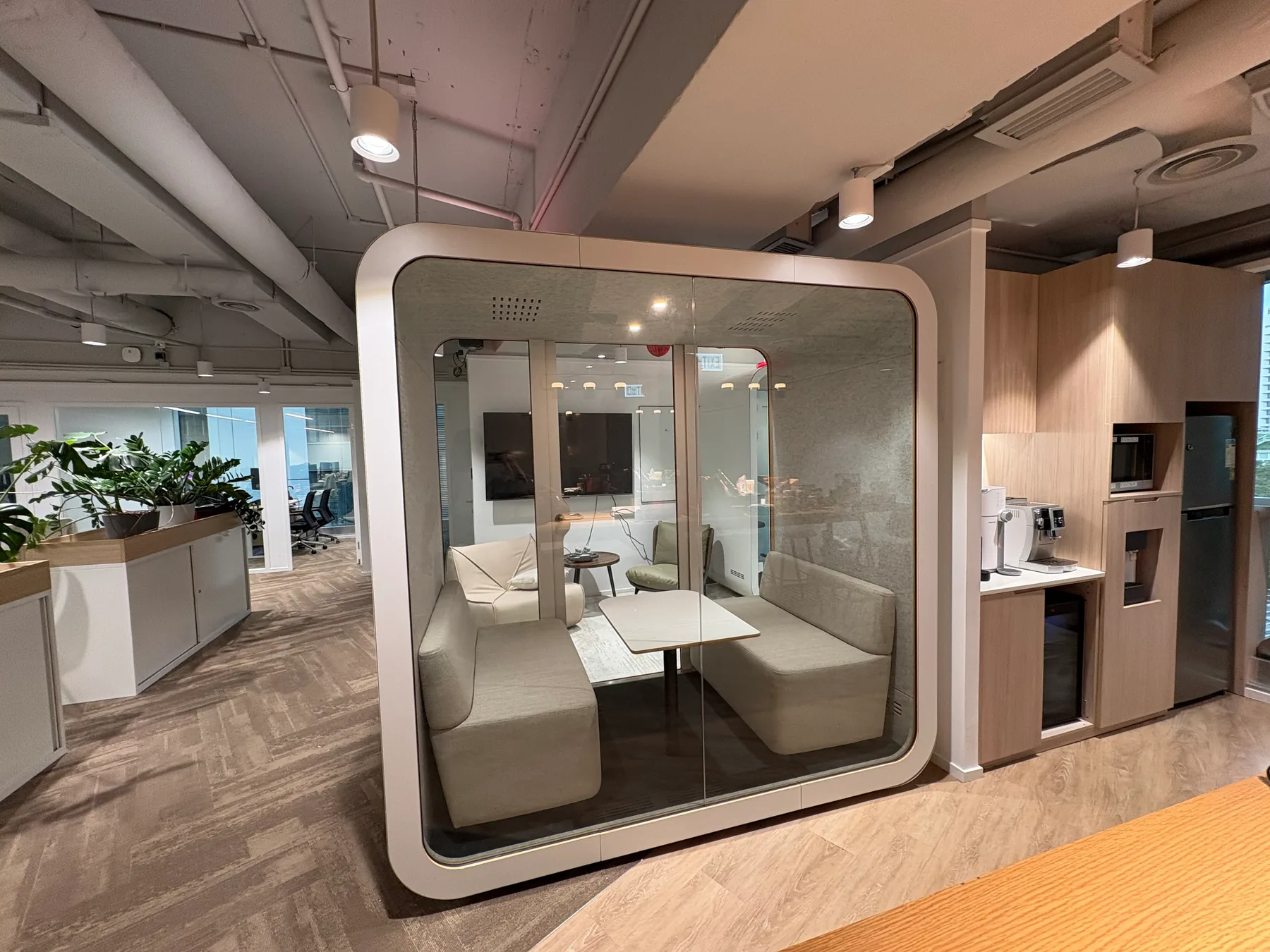 Hong Kong office meeting pod with integrated technology and acoustic detailing