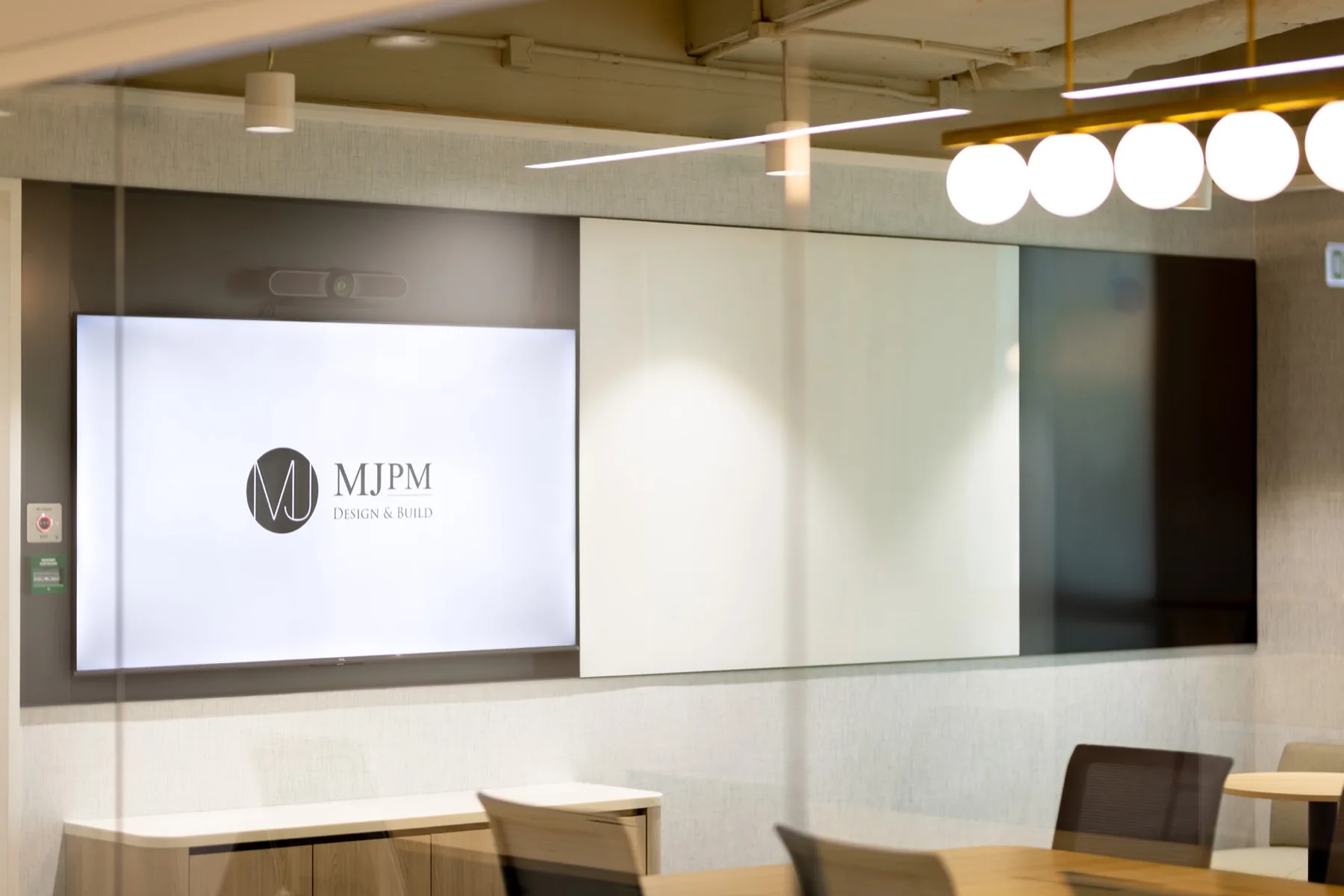 Hong Kong office arrival space with an integrated presentation screen