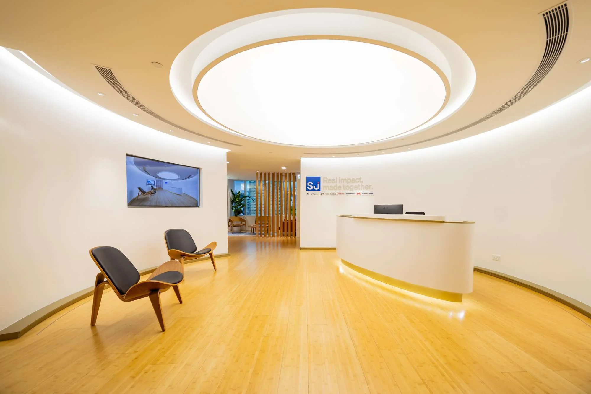 MJPM case study showing a detailed workplace interior with meeting settings, layered lighting and polished finishes