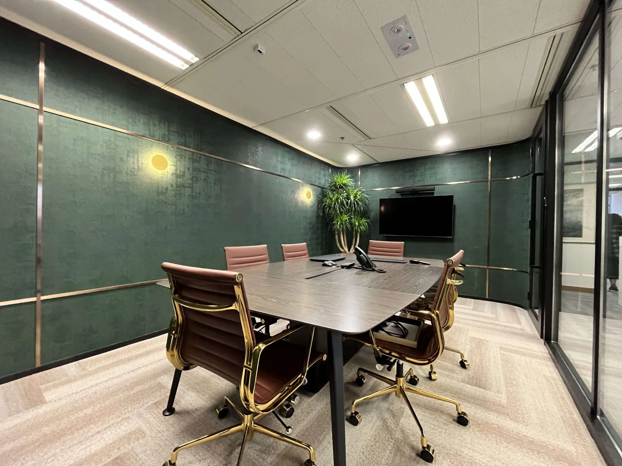 MJPM case study showing an executive boardroom with coordinated finishes and integrated meeting technology