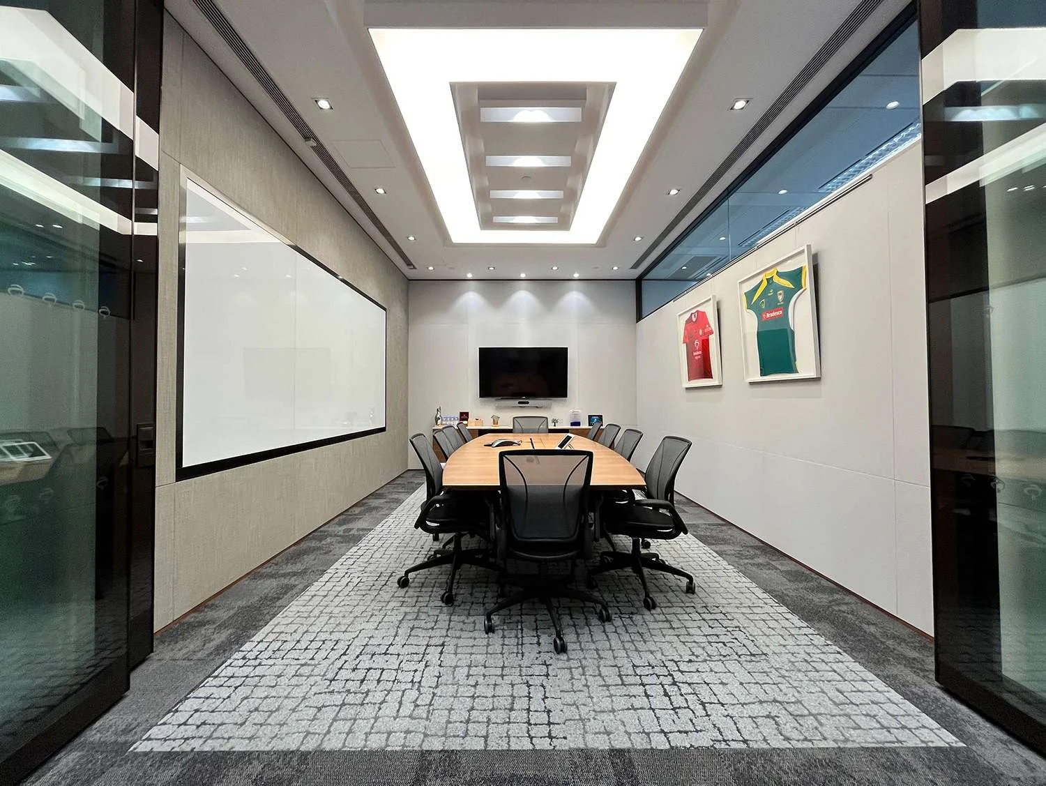 MJPM case study showing a focused workplace setting with detailed finishes and a biophilic feature wall