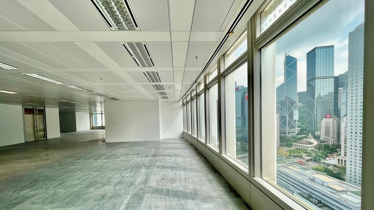 Vacant Hong Kong commercial office floor prepared for lease-end reinstatement with Central skyline views