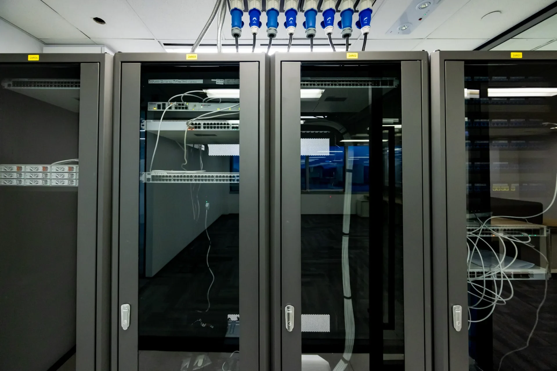 Fortinet server room with secured network racks, structured cabling and workplace technology infrastructure
